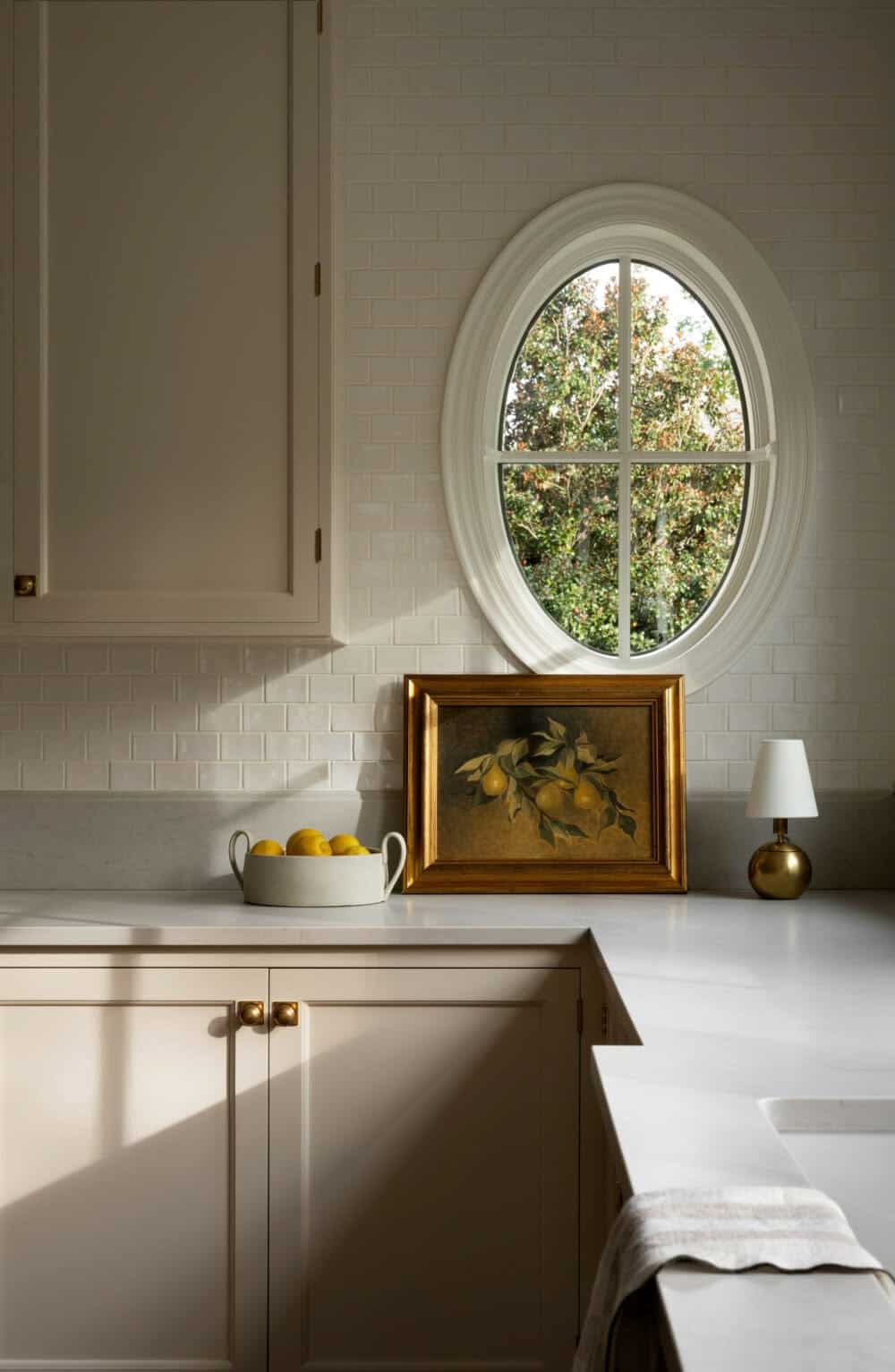 Shaker style cabinets in a light wood with quartz countertop.